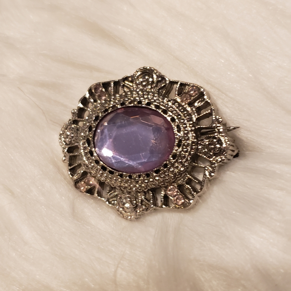 Silver brooch with lavender stone